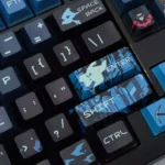 Nightwing Spirit artisan keycap set, dark blue and black, Cherry profile. Gallery view showcasing intricate details and exclusive emblem from various angles.