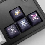 Premium PBT dye-sublimated One Piece keycaps, shown from various angles. Iconic pirate flags and emblems create a vibrant, high-quality, playful setup.