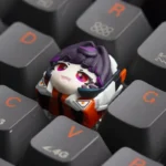 Multiple angles of a vibrant, handcrafted Overwatch Juno resin artisan keycap, showcasing its detailed sculpt and artistic gaming aesthetic.