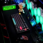 Crisp white CherryBomb PBT keycaps set with vibrant dye-sub legends displayed from different angles, showcasing their playful and durable design.