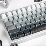 Multiple angles of Polar Day Refracted Shadow PBT side-print keycap set, highlighting their angular, translucent design and crisp light refraction.