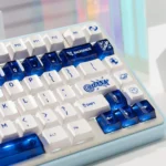 Luminous ceramic-like PC keycaps set in sapphire blue and pure white from various angles, showcasing their premium finish and radiant glow.