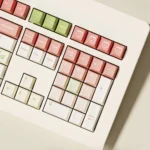 A playful collection of soft peach pink dye-sub PBT keycaps set showcased from various angles, highlighting their charming aesthetic and durable finish.