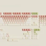 Gallery views of the soft peach pink dye-sub PBT keycap set, highlighting its gentle, fluffy aesthetic and durable quality from multiple angles.