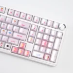 Multiple angles reveal the whimsical pink cat keycaps set cute peek-a-boo design and its captivating translucent crystal jelly finish.