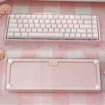 Charming pink mechanical keyboard with frosted keycaps, highlighting custom Belle switches for silent, ultra-light 32g actuation.