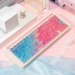 Detailed views of luminous pink PC keycaps set, showcasing their ethereal ocean gradient and translucent design that beautifully enhances vibrant RGB keyboard.