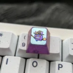 Premium titanium Pokemon Halloween ESC keycap in a detailed gallery view, highlighting its vibrant anime characters and exquisite metallic craftsmanship.