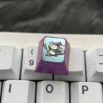 Premium titanium Pokemon Halloween ESC keycap, featuring vibrant anime characters in costumes with metallic finish and intricate details, a true colletors.