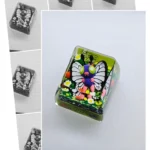 Vibrant sculpted Limited Edition Shiny Butterfree Pokemon Keycap, exquisitely encased in luminous resin, a unique collectible.