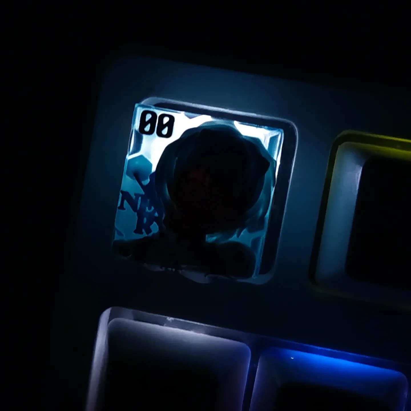 Artistic gallery of the iconic Rei Ayanami translucent resin keycap. See its ethereal glow and custom details on a mechanical keyboard.