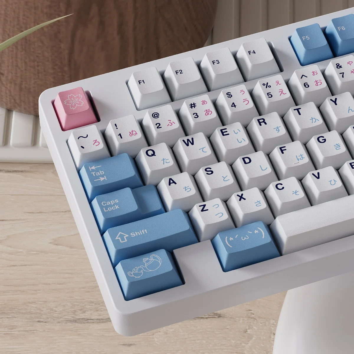 Exclusive Re:Zero Rem PBT dye-sub keycaps set, artfully displayed in a charming close-up, highlighting vibrant blue-white maid motifs.