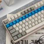 Multiple views of the Retro Flooding Series Cherry Keycap Set, highlighting their classic black finish and durable legends for a timeless design.