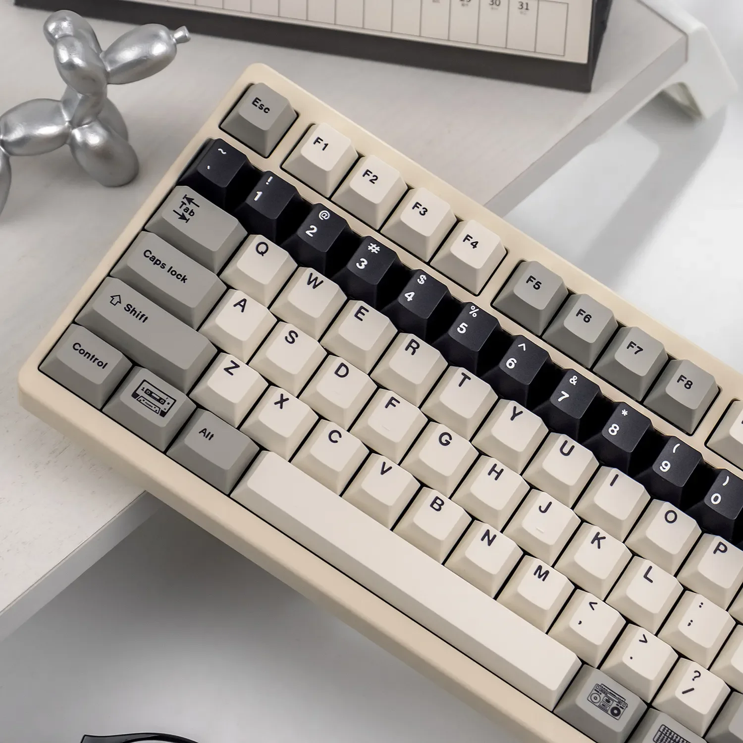 Explore Retro Flooding Series Cherry Keycap Set from multiple angles, showcasing their classic vintage style and crisp legends for enthusiasts.