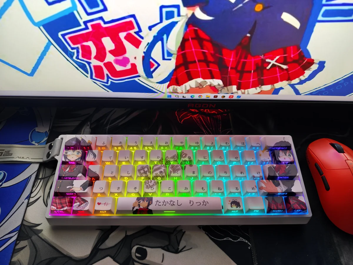 Vibrant Takanashi Rikka keycaps set with whimsical anime art, highlighting the unique side-printed, shine-through PBT legends from various angles.