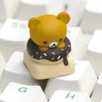 Iconic Rilakkuma Donut Artisan Keycap. Charming Rilakkuma keycap featuring the beloved character and a sweet donut, handcrafted in vibrant resin.