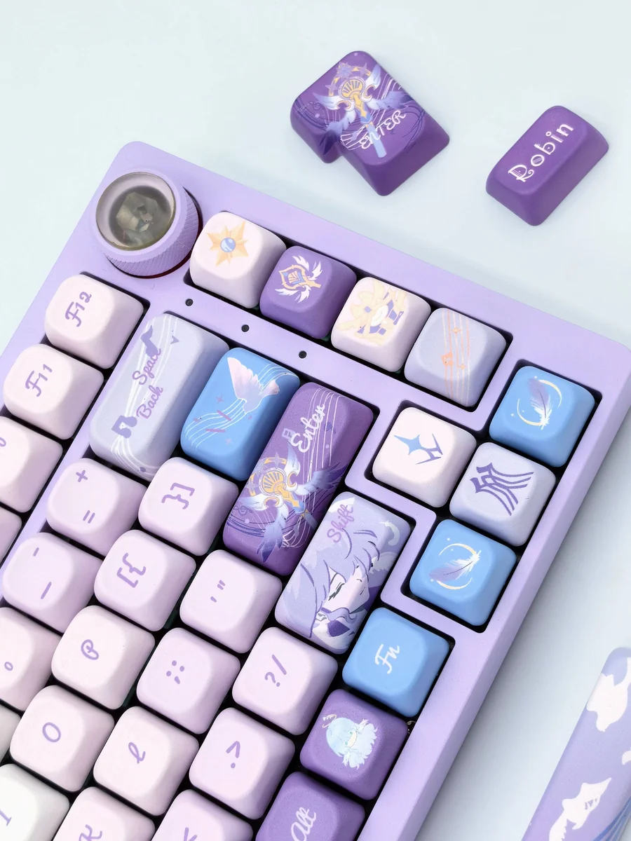 Close-up of the distinctive Robin FOA Keycap Set, showcasing their serene pastel hue and artistic design details from a unique angle.