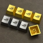 Iconic ROG Logo Alloy Keycaps displayed from multiple aggressive angles, highlighting its premium metallic finish and angular design for magnetic switch.