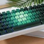 Gallery of the Enchanting Luminous Rose Keycaps Set, showcasing delicate pink and green PBT gradient keycaps with side-lit floral designs.