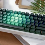 Enchanting PBT luminous rose keycaps set from different angles, showcasing delicate pink and green gradient floral designs with vibrant side-lit glow.