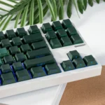 Enchanting luminous PBT rose keycaps set gallery. Delicate pink-green gradient floral design, side-lit translucency, and vibrant RGB glow from multiple angles view.