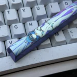 Premium Roxy Migurdia Titanium Alloy Space key keycap gallery, showcasing vibrant anime art from multiple angles on polished, colored titanium for artistic design.