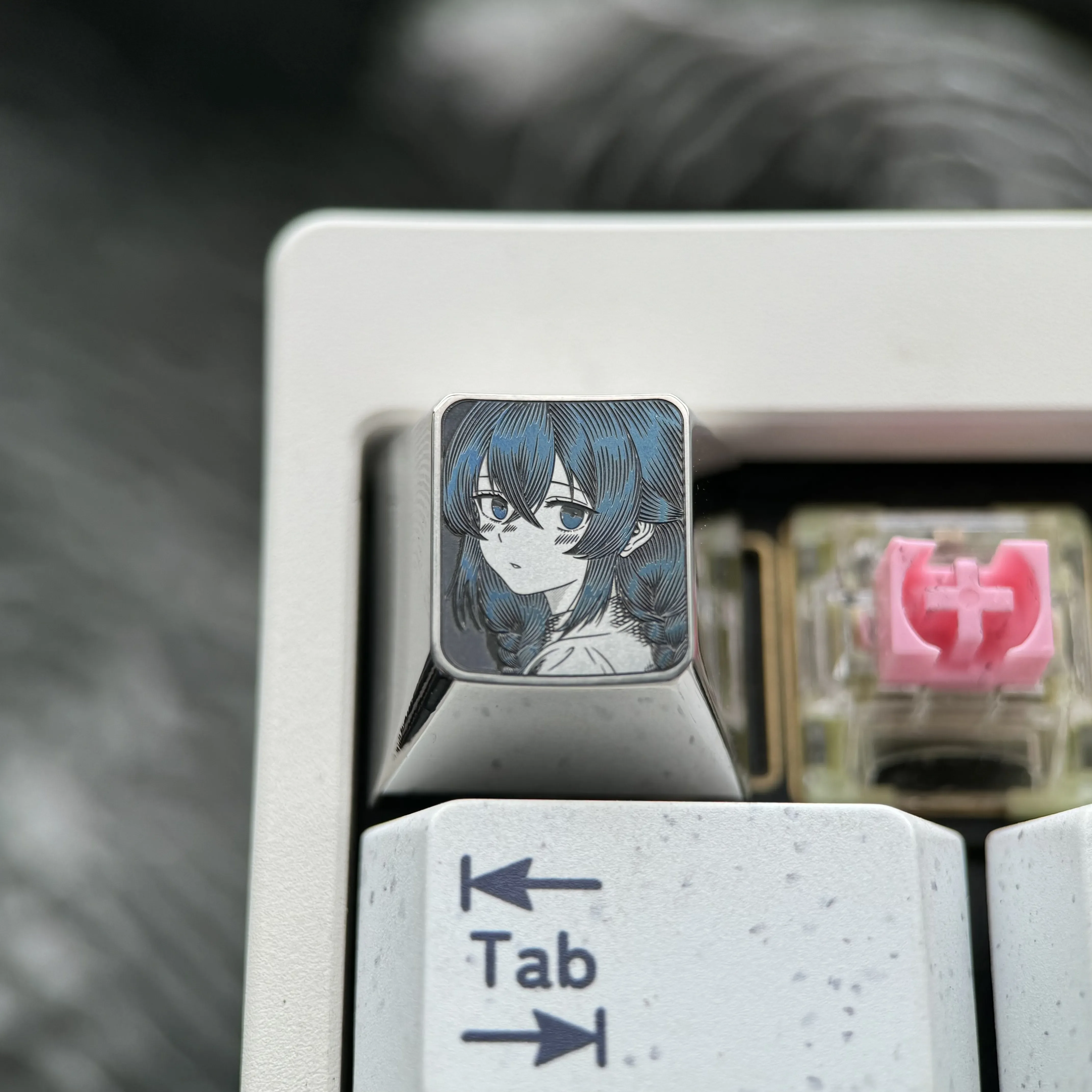 Gallery views of the Roxy Titanium Keycap, highlighting its precision-carved anime art, polished titanium finish, and intricate details from various angles.