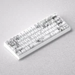 Iconic Saber keycap set gallery: PBT keycap set with elegant monochrome line art, shown from multiple angles, emphasizing its minimalist anime aesthetic.