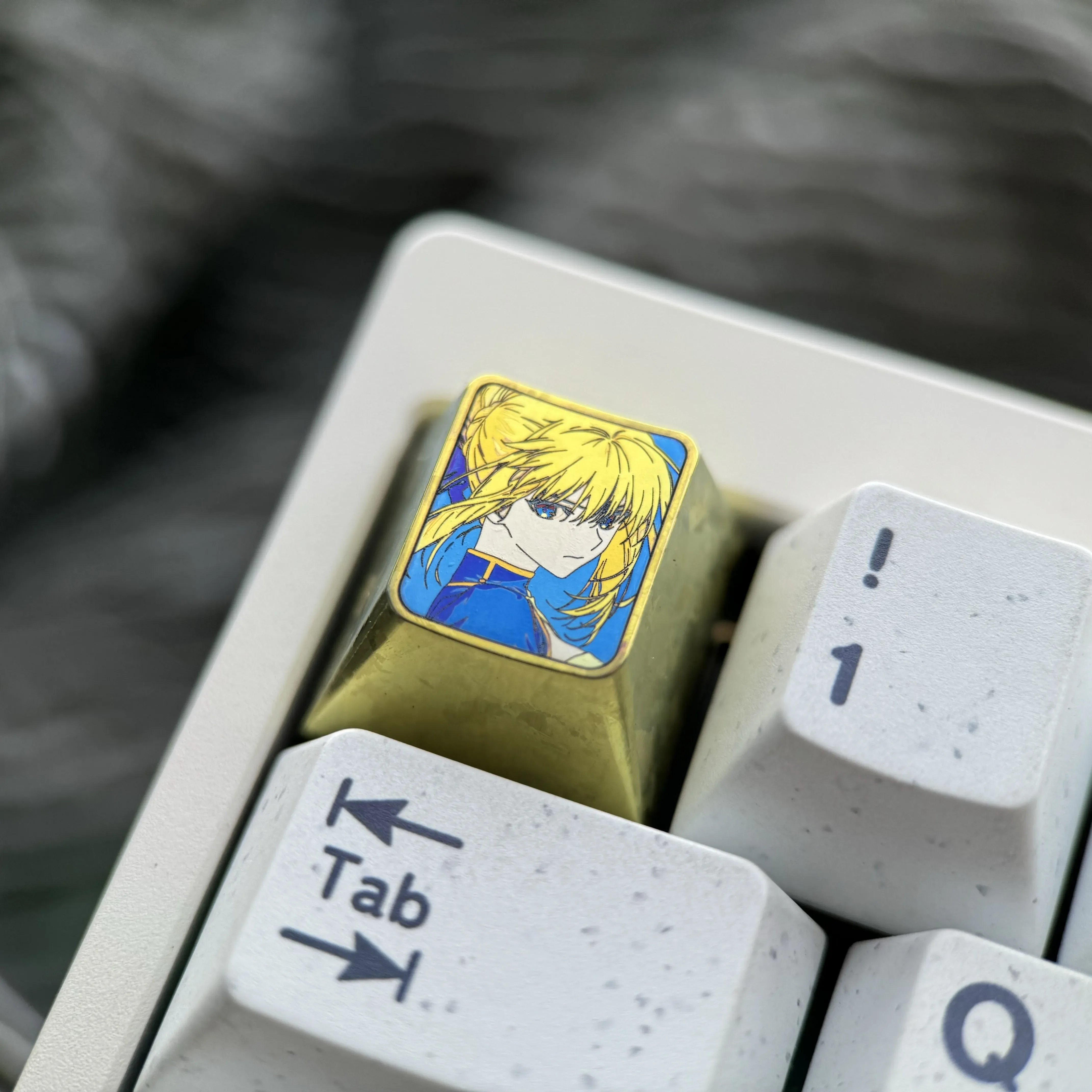 Vibrant Saber titanium alloy keycap, an artisan anime metal keycap for mechanical keyboards, showcasing its premium anodized finish and iconic hero design.