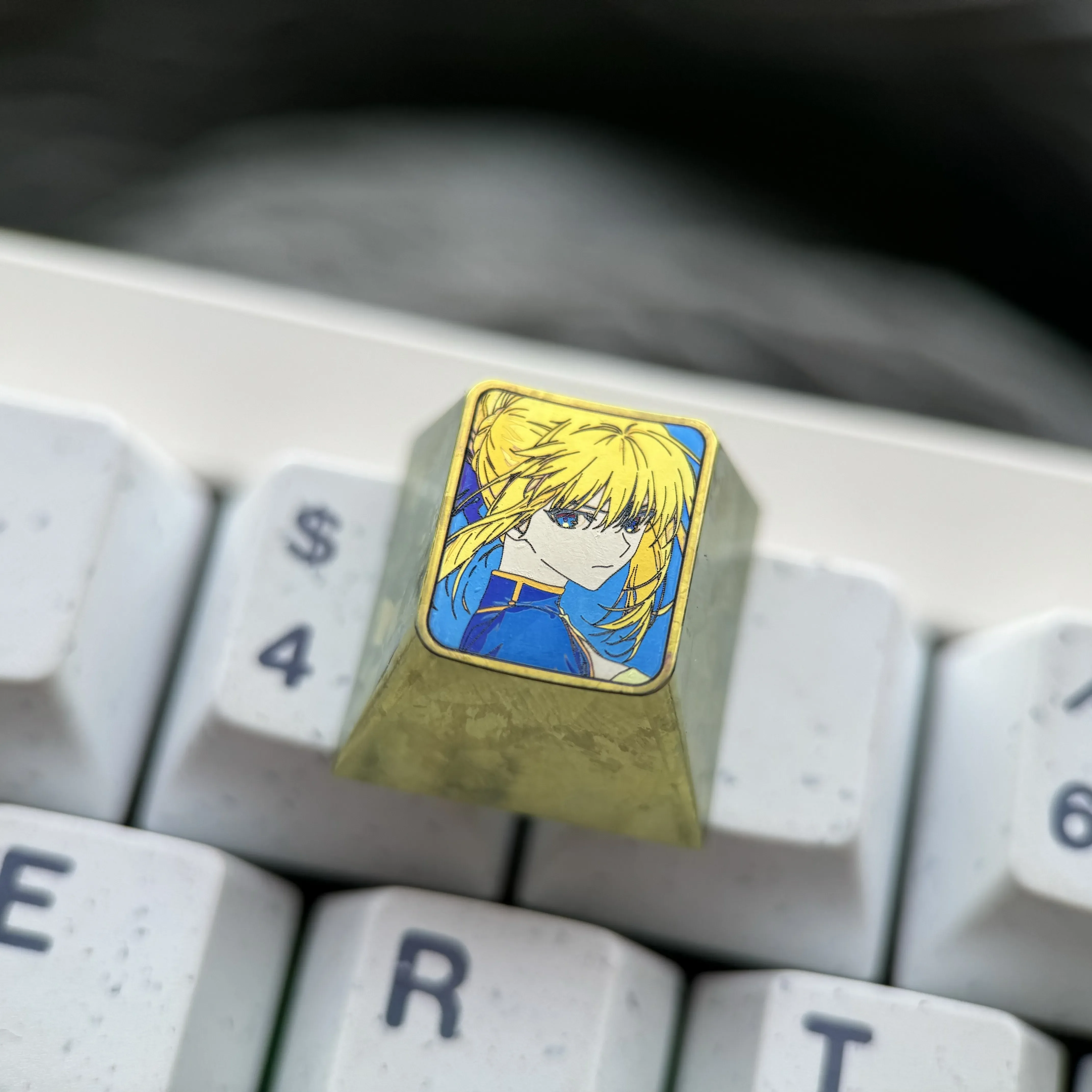 Detailed gallery of the artisan Vibrant Saber titanium alloy keycap, showcasing its premium anime design, anodized metallic hues from multiple angles.