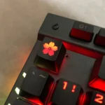 Gallery of the Glowing Sakura ESC keycap, displaying its delicate cherry blossom design and premium backlit ABS from various artistic angles.