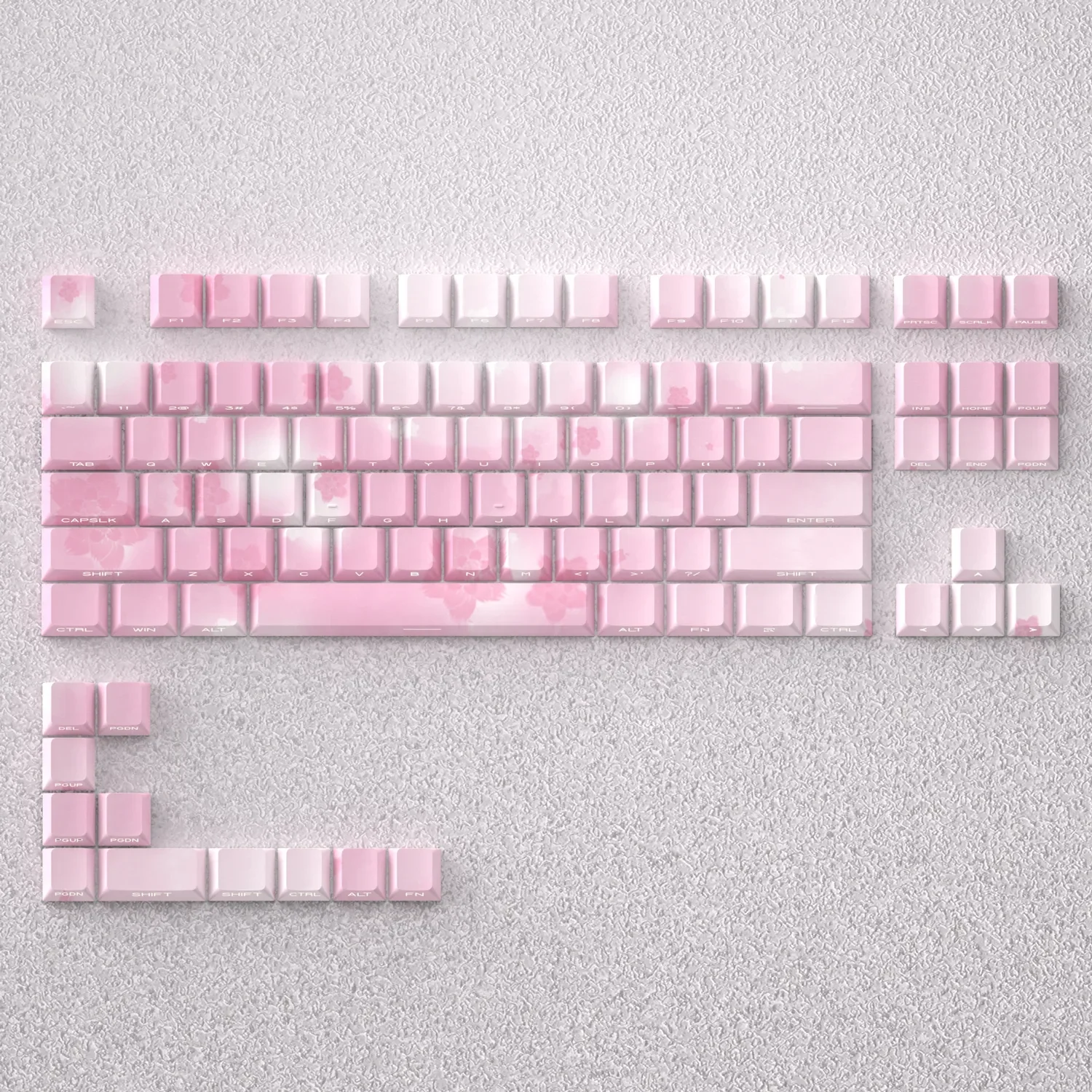 Elegant Sakura Keycaps Set, PBT side-lit, artfully display delicate pink and white cherry blossoms and clean backlit legends on a mechanical keyboard.