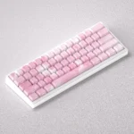 A collection of elegant Sakura Keycaps Set, showcasing the PBT side-lit design with delicate pink cherry blossoms against a serene white palette.