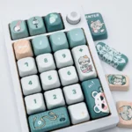 Detailed view of the Sariel FOA Keycap Set, displaying exclusive character-themed legends, serene cool tones, and intricate motifs.