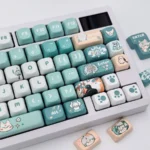 Exclusive Sariel FOA Keycap Set, showcasing serene cool-toned legends and elegant character motifs from multiple angles. Premium artistic design.