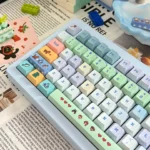 Playful gallery view of Stardew Valley keycaps Set, displaying various pixel art characters, tools, and landscapes on durable PBT.