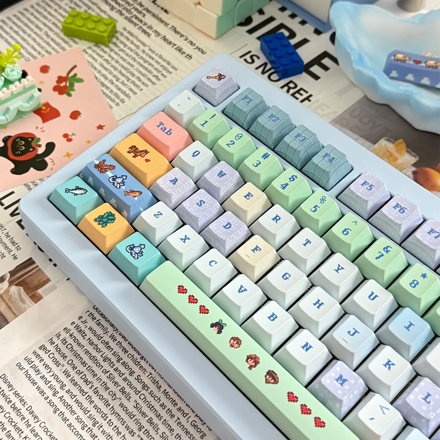Playful gallery view of Stardew Valley keycaps Set, displaying various pixel art characters, tools, and landscapes on durable PBT.