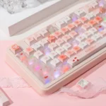 Strawberry Keycap Set: durable PBT & frosted PC. Vibrant strawberry motifs, soft pastel colors, and unique translucent accents are visible.