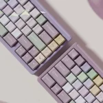 Taro Pistachio PBT keycaps set in a sweet pastel blend of purple, green, and cream, viewed from multiple angles, highlighting their whimsical dessert-inspired.