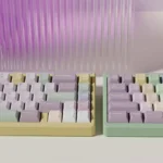 Taro Pistachio PBT keycaps set in pastel purple, green, and cream, showcased from various playful angles, highlighting their unique dessert theme.