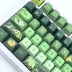 A gallery of Tighnari Genshin Impact PBT keycaps set from multiple angles, highlighting vibrant forest green designs and exclusive character art.