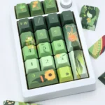 Exclusive Tighnari Genshin Impact PBT keycaps set, displaying vibrant forest green nature motifs and character artistry across the full collection.