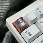 A collection of Citlali Titanium Anime Keycaps showcasing vibrant character art, metallic luster, and intricate artisan detailing from various angles.