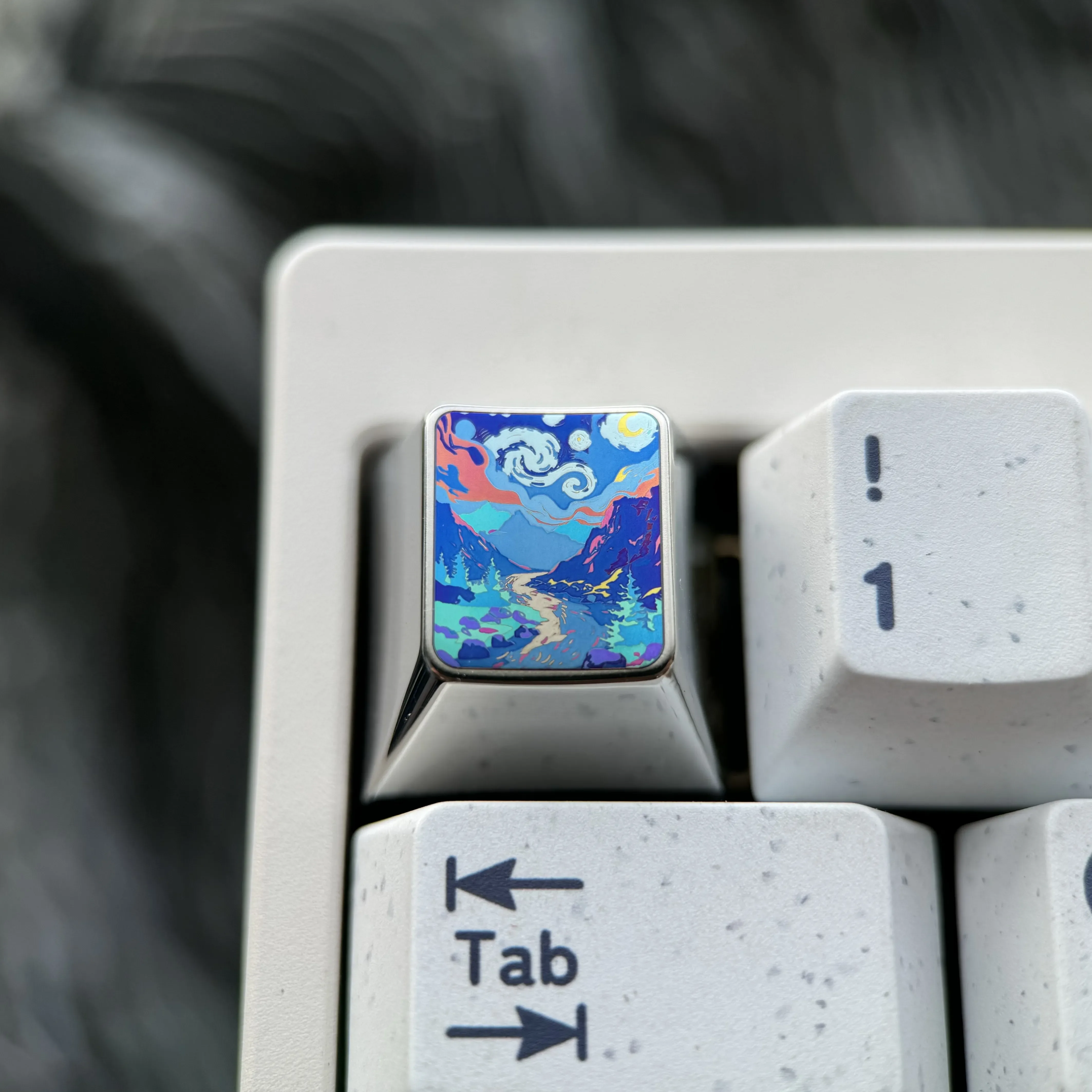 Sculpted mountain valley titanium artisan keycap, handcrafted with a vibrant, fade-resistant finish, showcasing premium metallic texture.