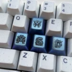 Titanium Gundam WASD gaming keycaps showcasing a futuristic design with vibrant anodized finishes for a premium setup.