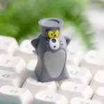 A playful, handcrafted Tom Jerry resin artisan keycap from a unique angle, highlighting its whimsical 3D art and nostalgic charm.