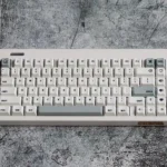 Tyche-One Minimalist PBT Keycaps Set displayed, highlighting their clean aesthetic and crisp dye-sub legends. Durable PBT ensures premium quality.