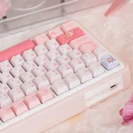 UR82 Peach Hifi Gasket Tri-Mode Custom Mechanical Keyboard Kit with MICCO Keycaps, presented elegantly from multiple angles, highlighting its soft design.