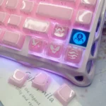 Enchanting Valorant keycaps, featuring translucent pink glitter for mechanical keyboards, showcased from multiple angles.