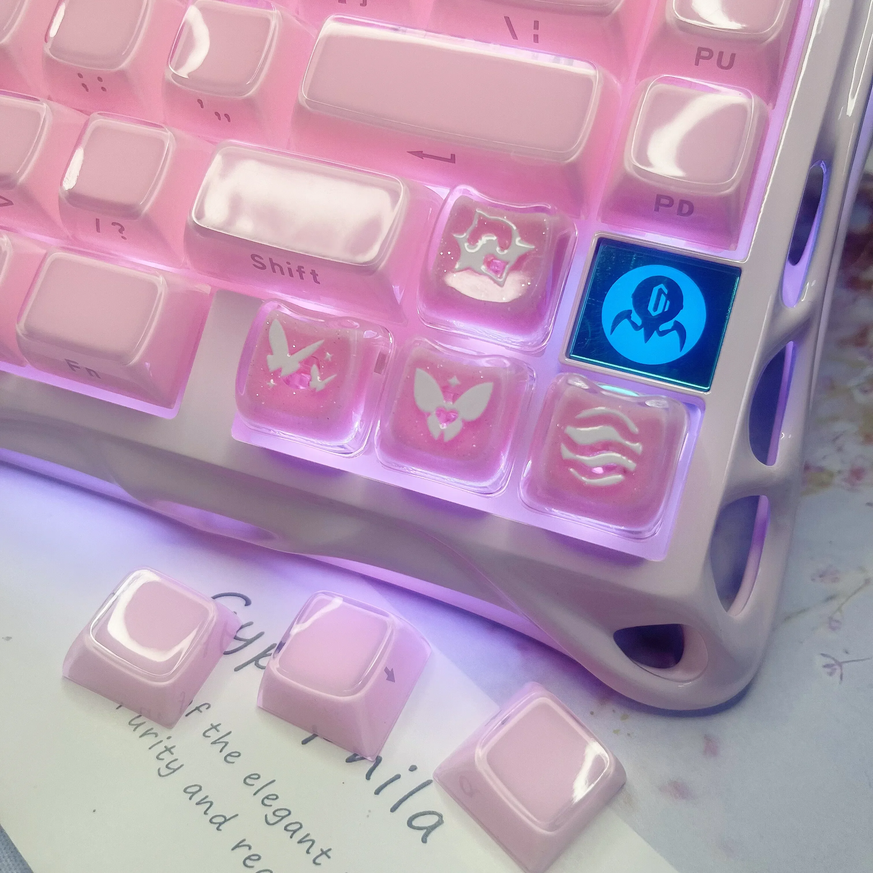 Enchanting Valorant keycaps, featuring translucent pink glitter for mechanical keyboards, showcased from multiple angles.